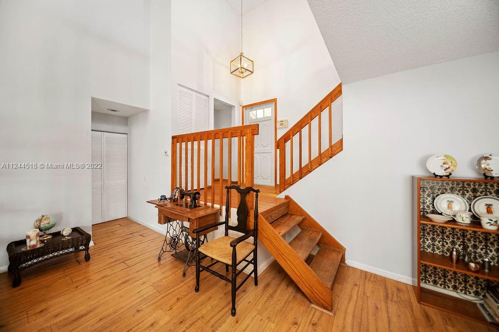 14914 Southwest 142nd Place Miami, FL 33186 - Photo 10 of 27 a living room with furniture and wooden floor