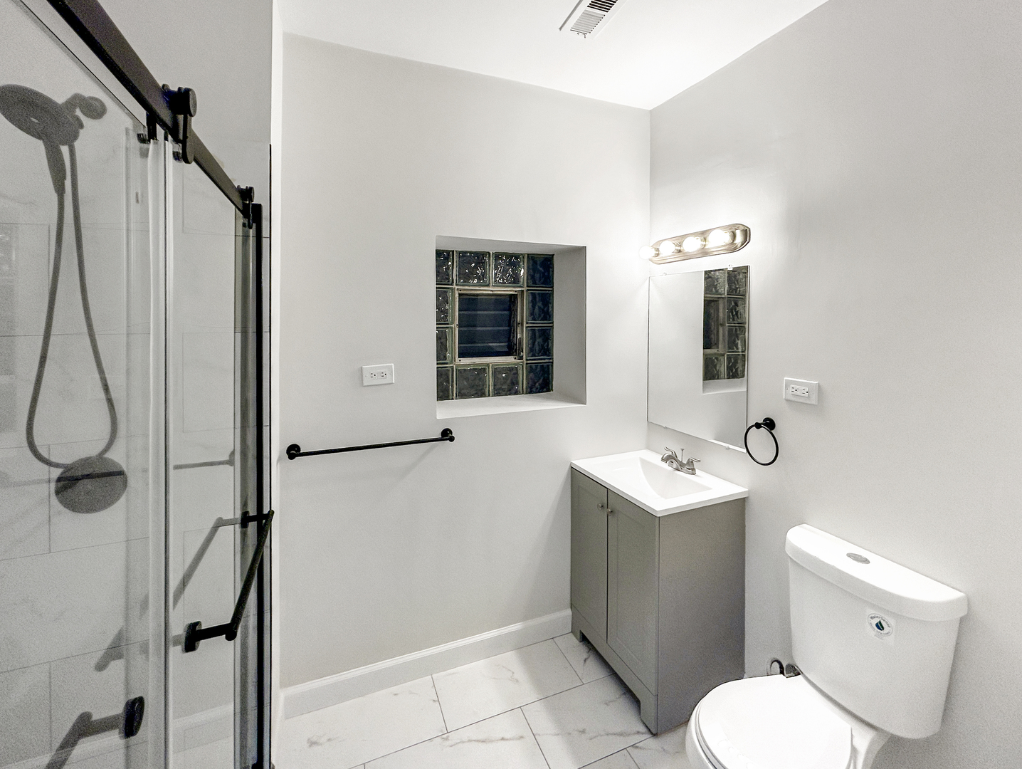 2953 West Warren Boulevard, Unit 2 Chicago, IL 60612 - Photo 14 of 31 a bathroom with a toilet sink and mirror