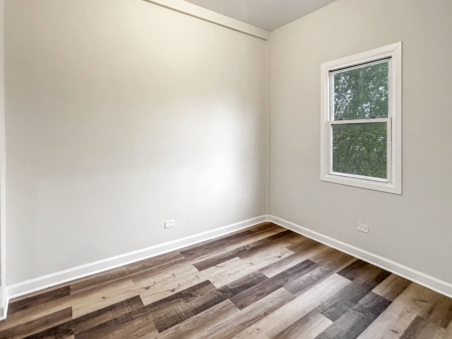 2953 West Warren Boulevard, Unit 2 Chicago, IL 60612 - Photo 20 of 31 a view of a room with wooden floor and a window