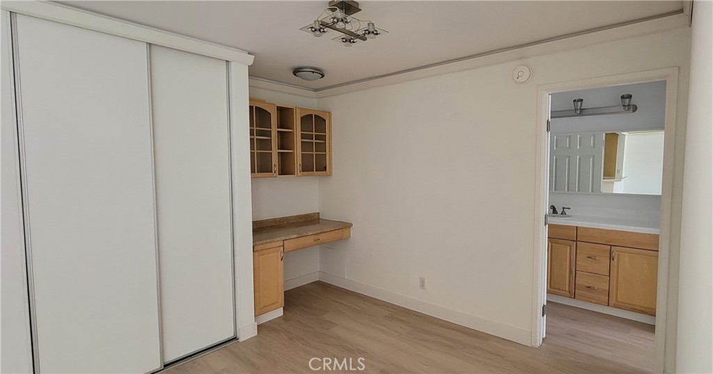 8740 Tuscany Avenue Playa del Rey, CA 90293 - Photo 7 of 21 a view of a hallway and a bathroom with a sink