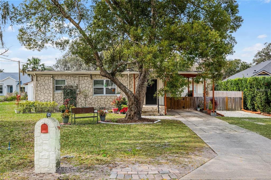 2160 Corbett Road, Unit B Orlando, FL 32826 - Photo 1 of 1 a front view of house with outdoor seating and green space