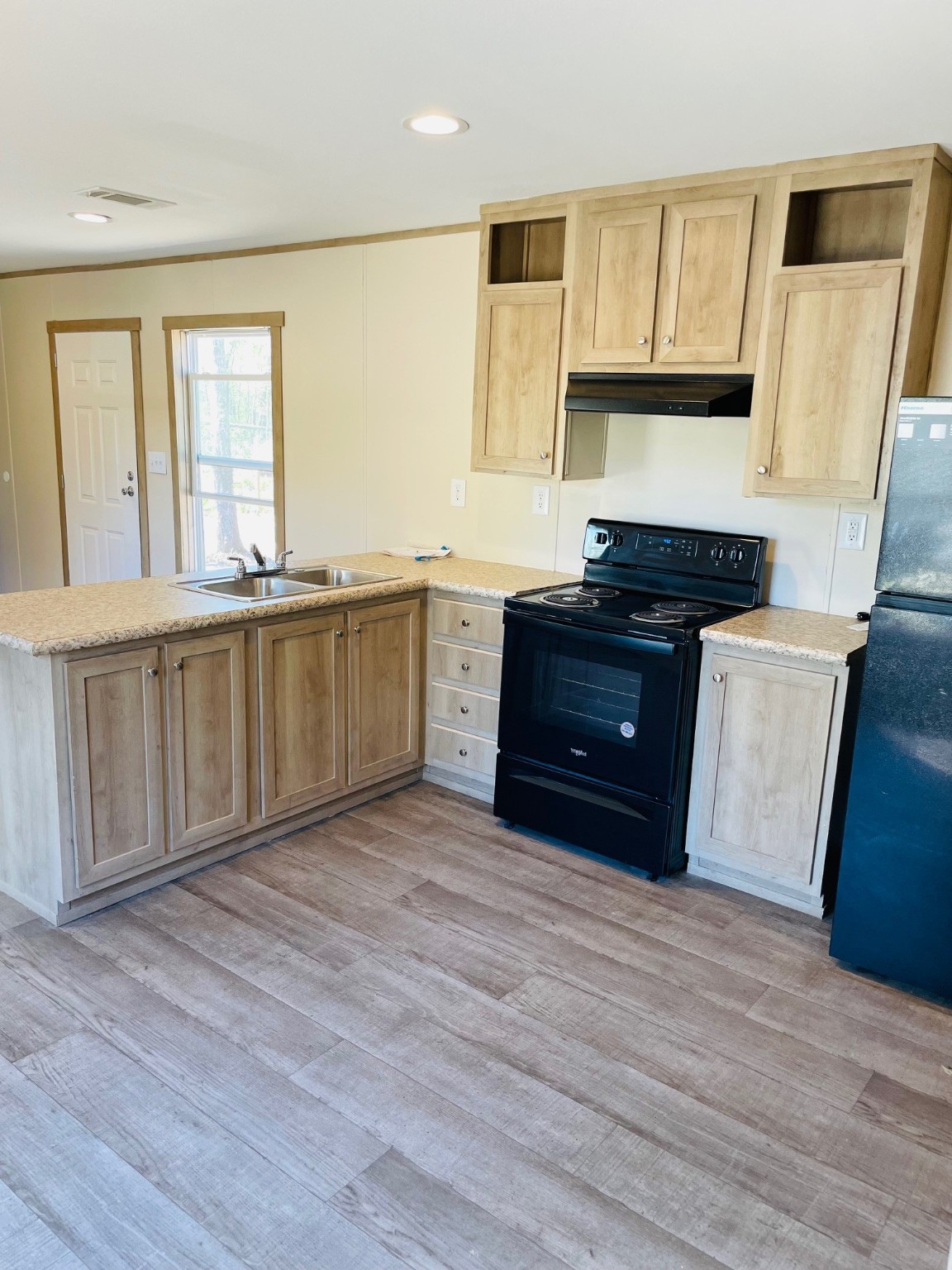 30 Hellon Lane Shepherd, TX 77371 - Photo 3 of 14 a large kitchen with granite countertop a stove and a sink