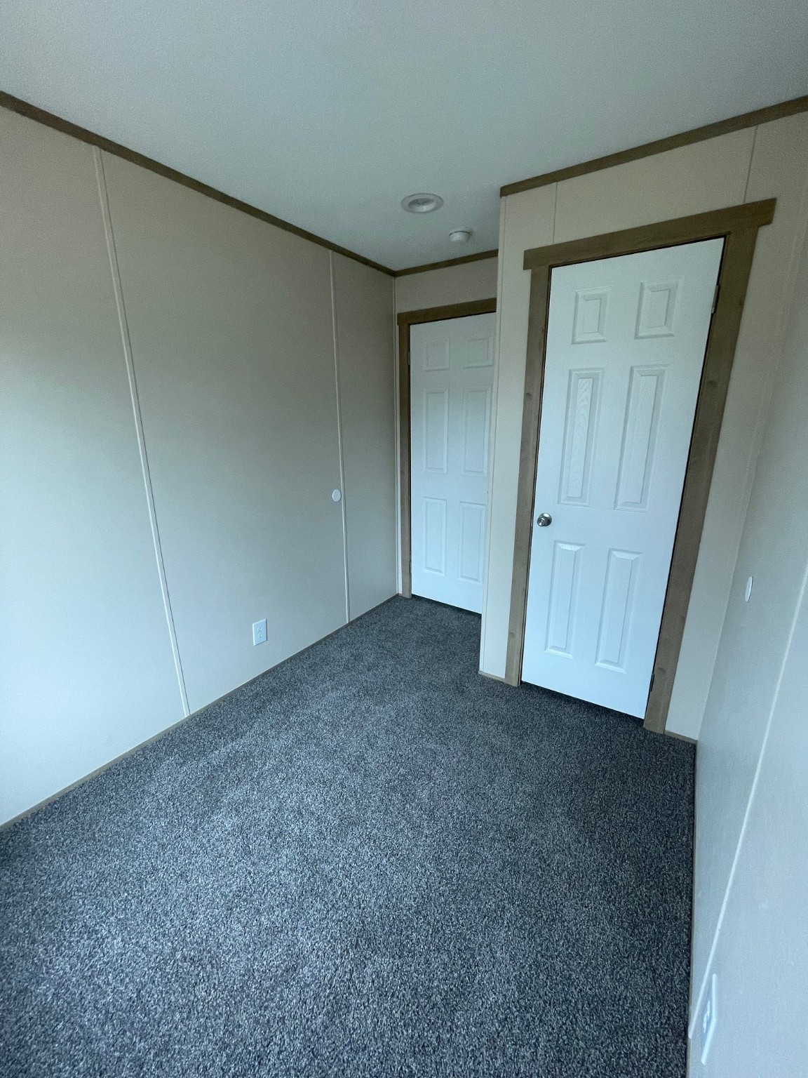 30 Hellon Lane Shepherd, TX 77371 - Photo 8 of 14 an empty room with a wooden door