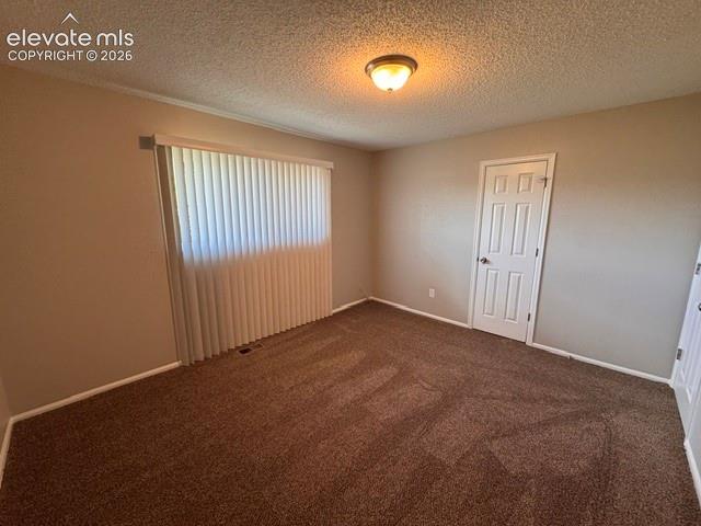 1922 Monterey Road Colorado Springs, CO 80910 - Photo 13 of 21 an empty room with windows and closet