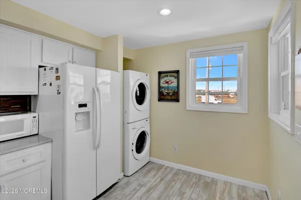 a white refrigerator freezer sitting inside of a kitchen