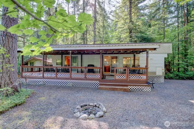 a view of a house with a bed and a patio