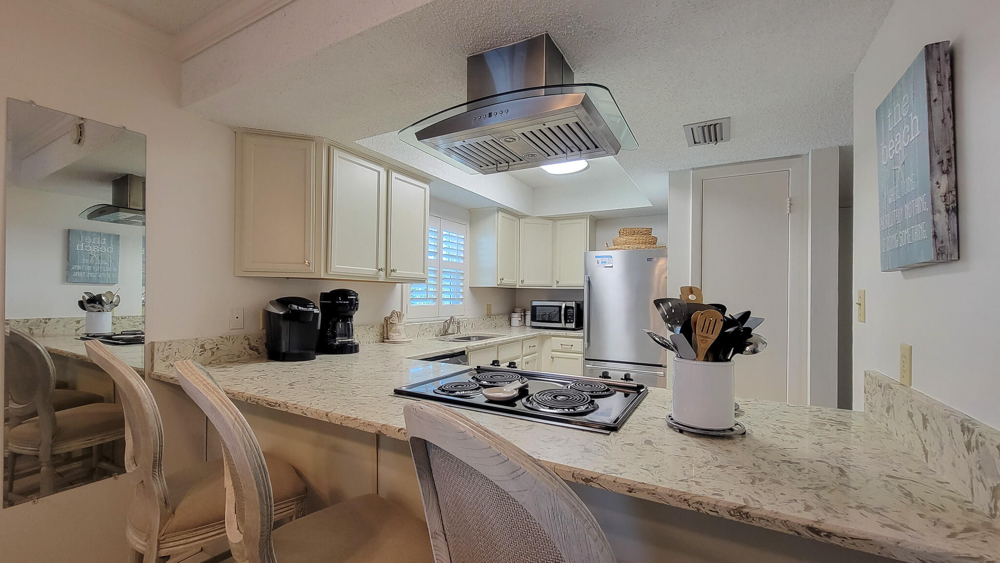 a kitchen with a dining table and chairs