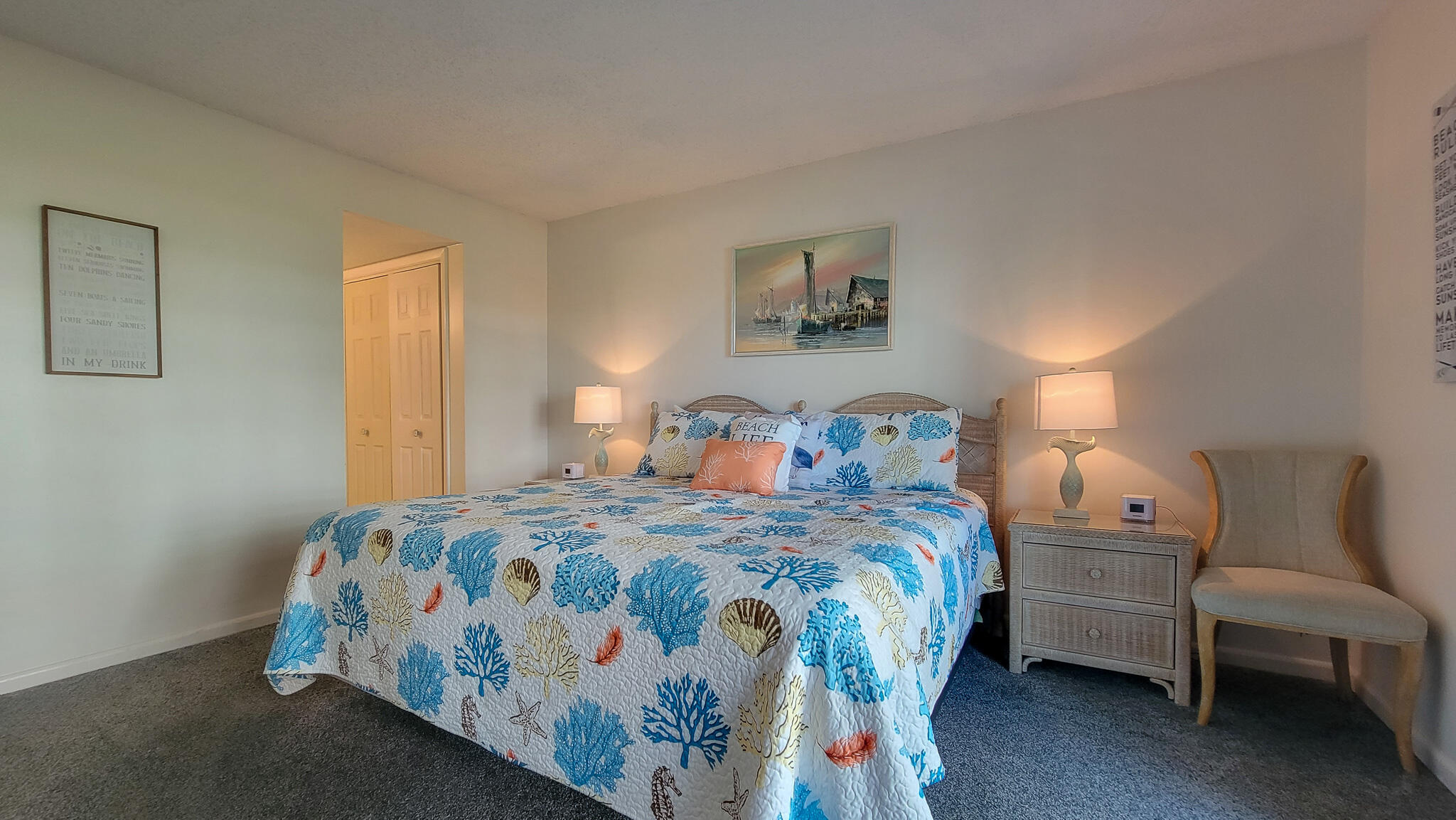 909 Santa Rosa Boulevard, Unit 319 Fort Walton Beach, FL 32548 - Photo 11 of 39 a bedroom with a bed and a couch