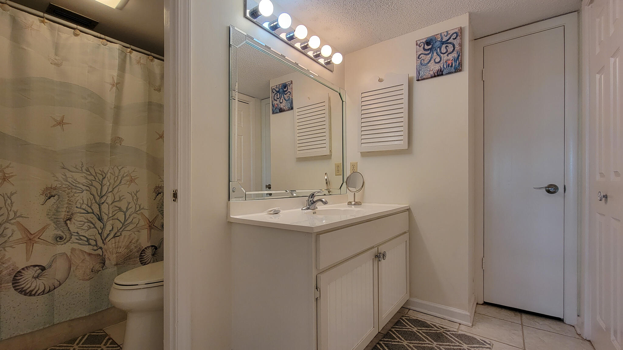 909 Santa Rosa Boulevard, Unit 319 Fort Walton Beach, FL 32548 - Photo 15 of 39 a bathroom with a sink toilet and shower