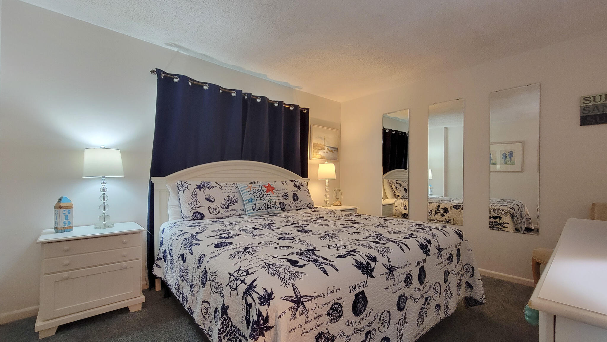 909 Santa Rosa Boulevard, Unit 319 Fort Walton Beach, FL 32548 - Photo 17 of 39 a bedroom with a large bed and a dresser