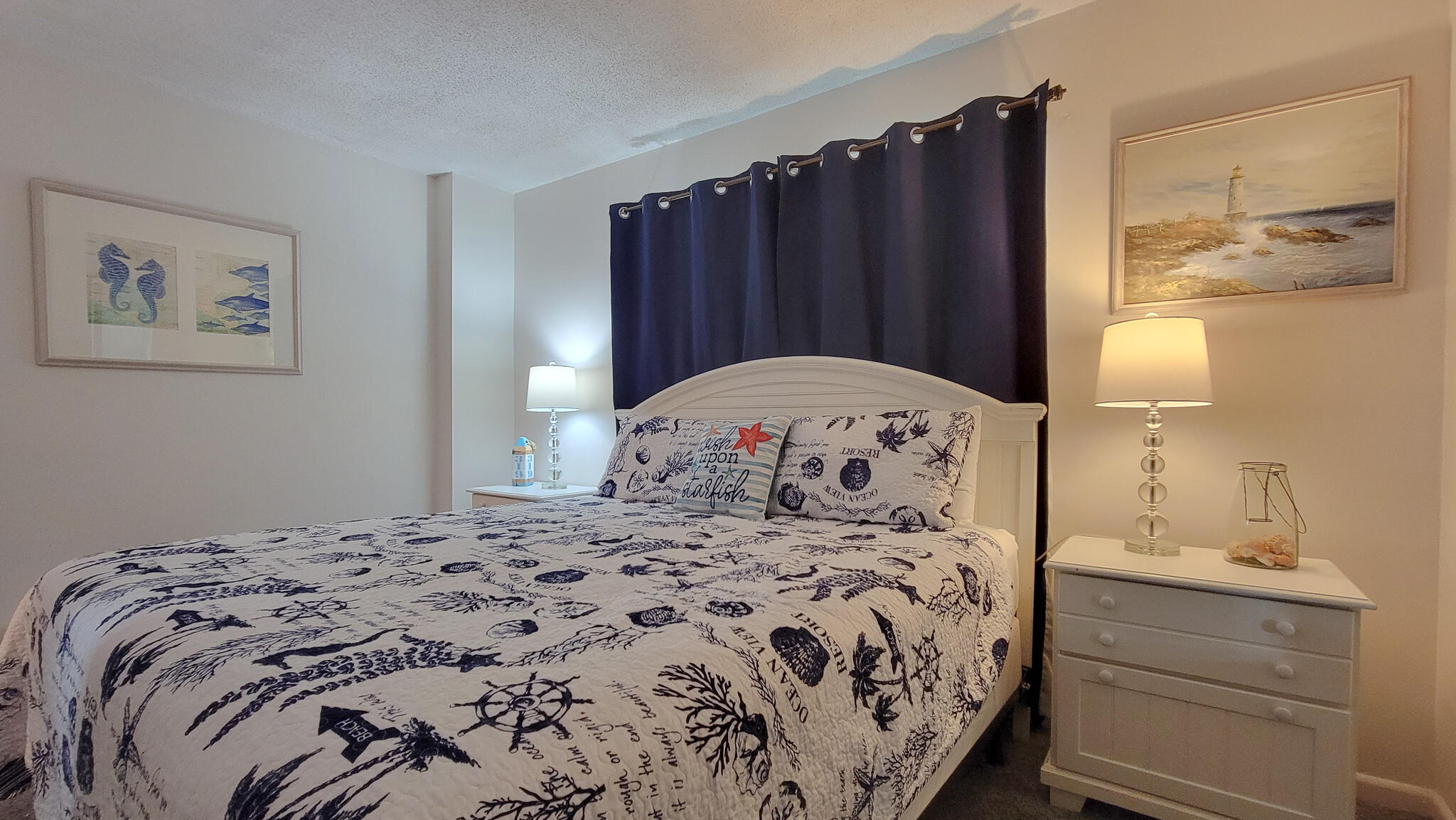 909 Santa Rosa Boulevard, Unit 319 Fort Walton Beach, FL 32548 - Photo 19 of 39 a bedroom with a bed and a mirror