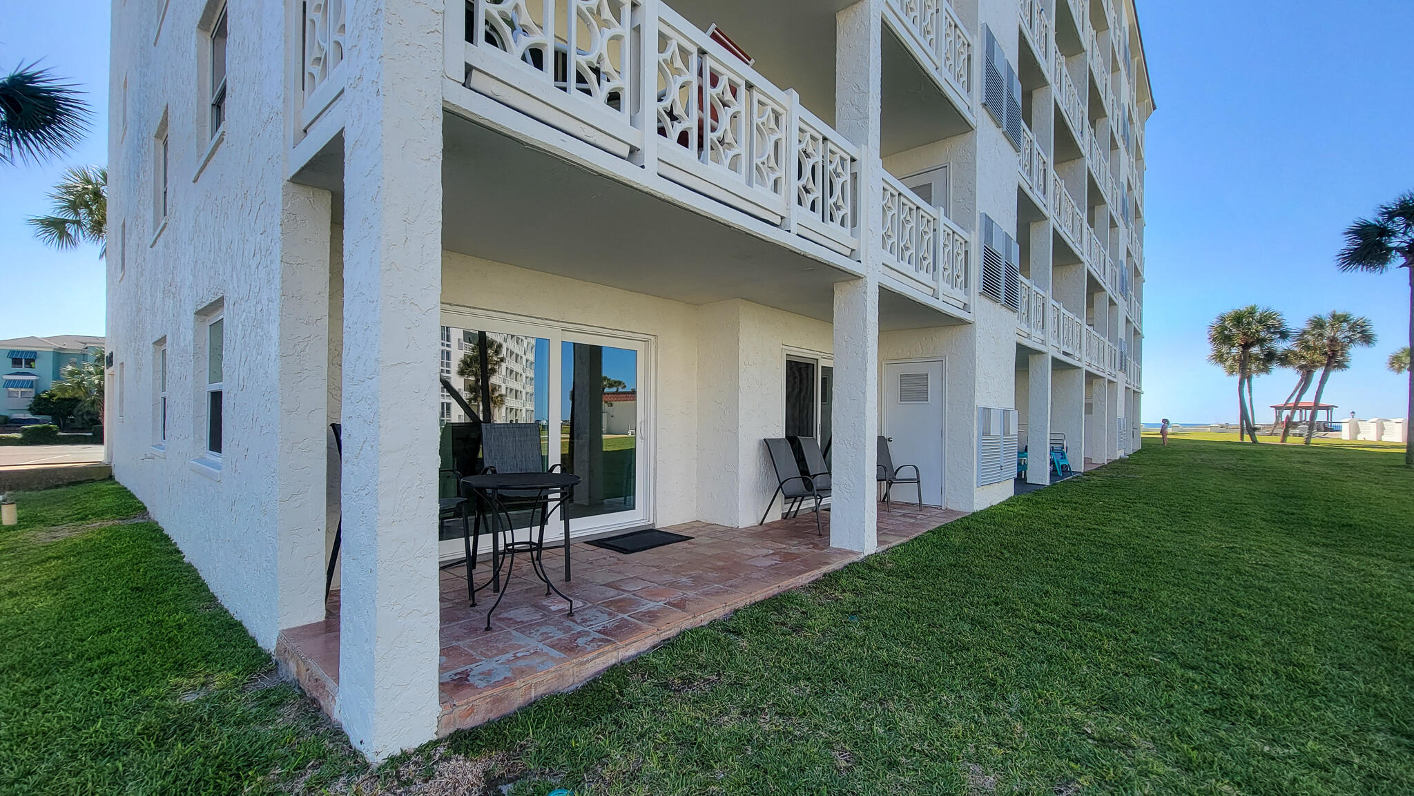 909 Santa Rosa Boulevard, Unit 319 Fort Walton Beach, FL 32548 - Photo 21 of 39 a view of porch with seating space and garden