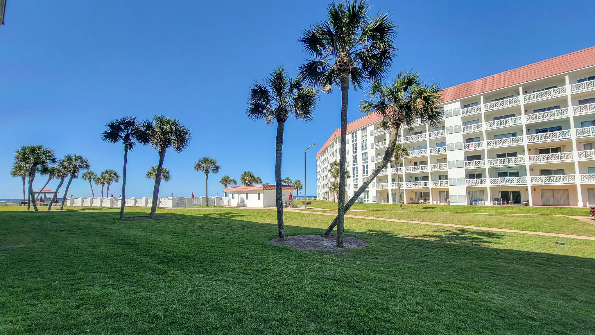 909 Santa Rosa Boulevard, Unit 319 Fort Walton Beach, FL 32548 - Photo 24 of 39 a view of a big room with a palm trees