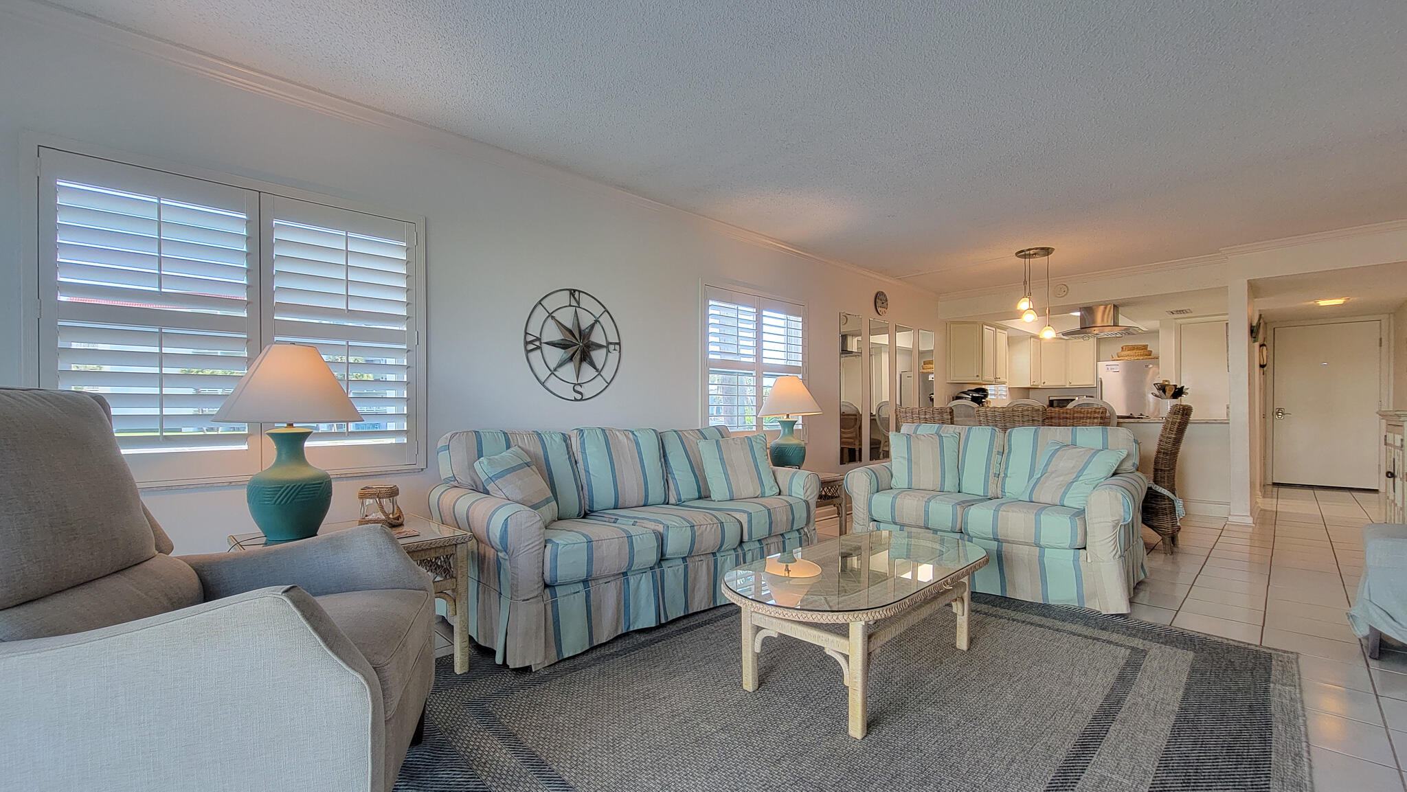 909 Santa Rosa Boulevard, Unit 319 Fort Walton Beach, FL 32548 - Photo 10 of 39 a living room with furniture and a table