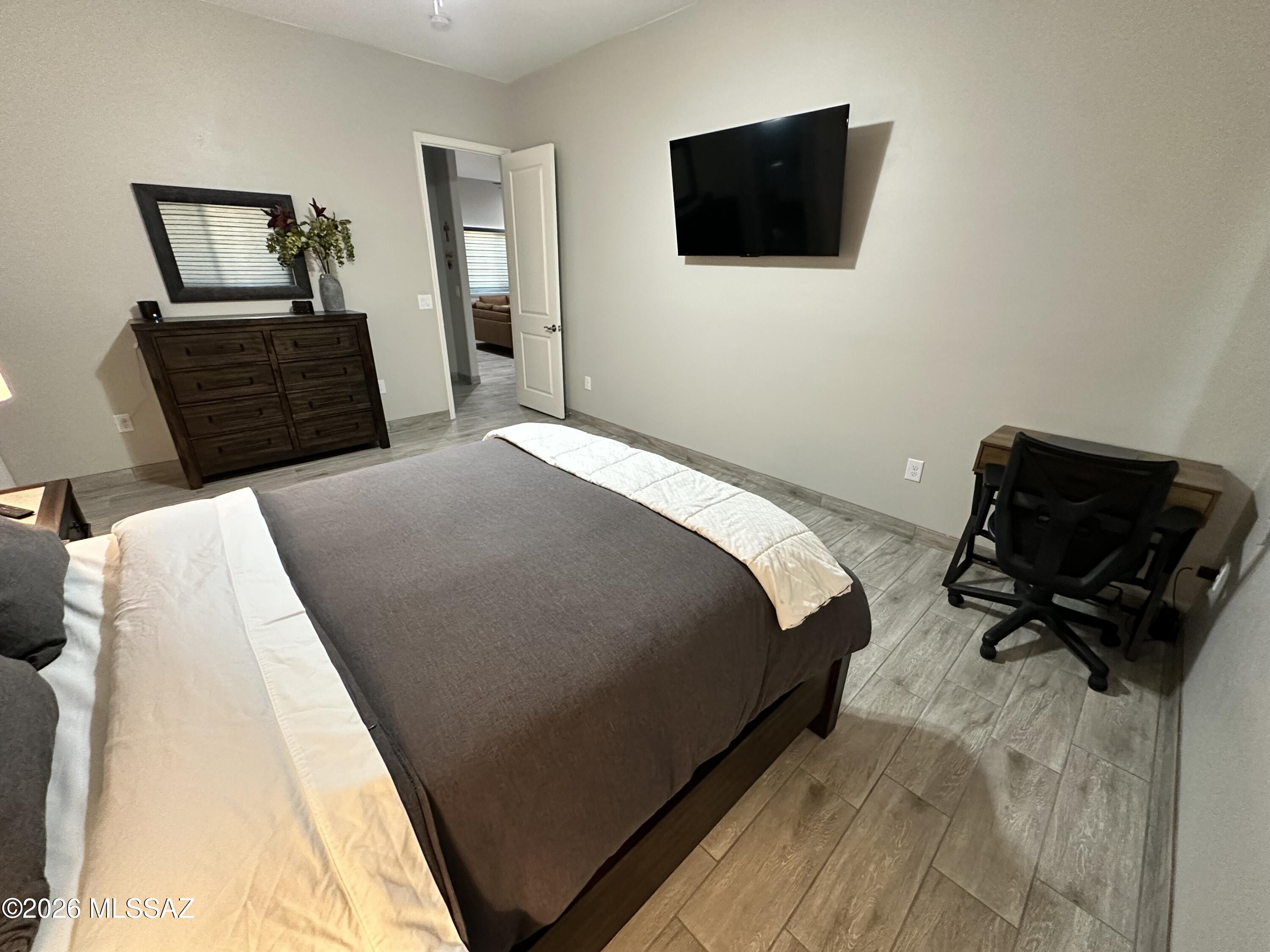 117 Ver Patria Rio Rico, AZ 85648 - Photo 20 of 28 a bedroom with a bed and a television
