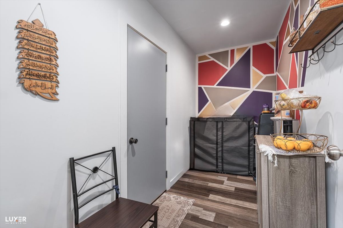 6908 Orchard Lane Hanover Park, IL 60133 - Photo 14 of 28 a view of an entryway with wooden floor