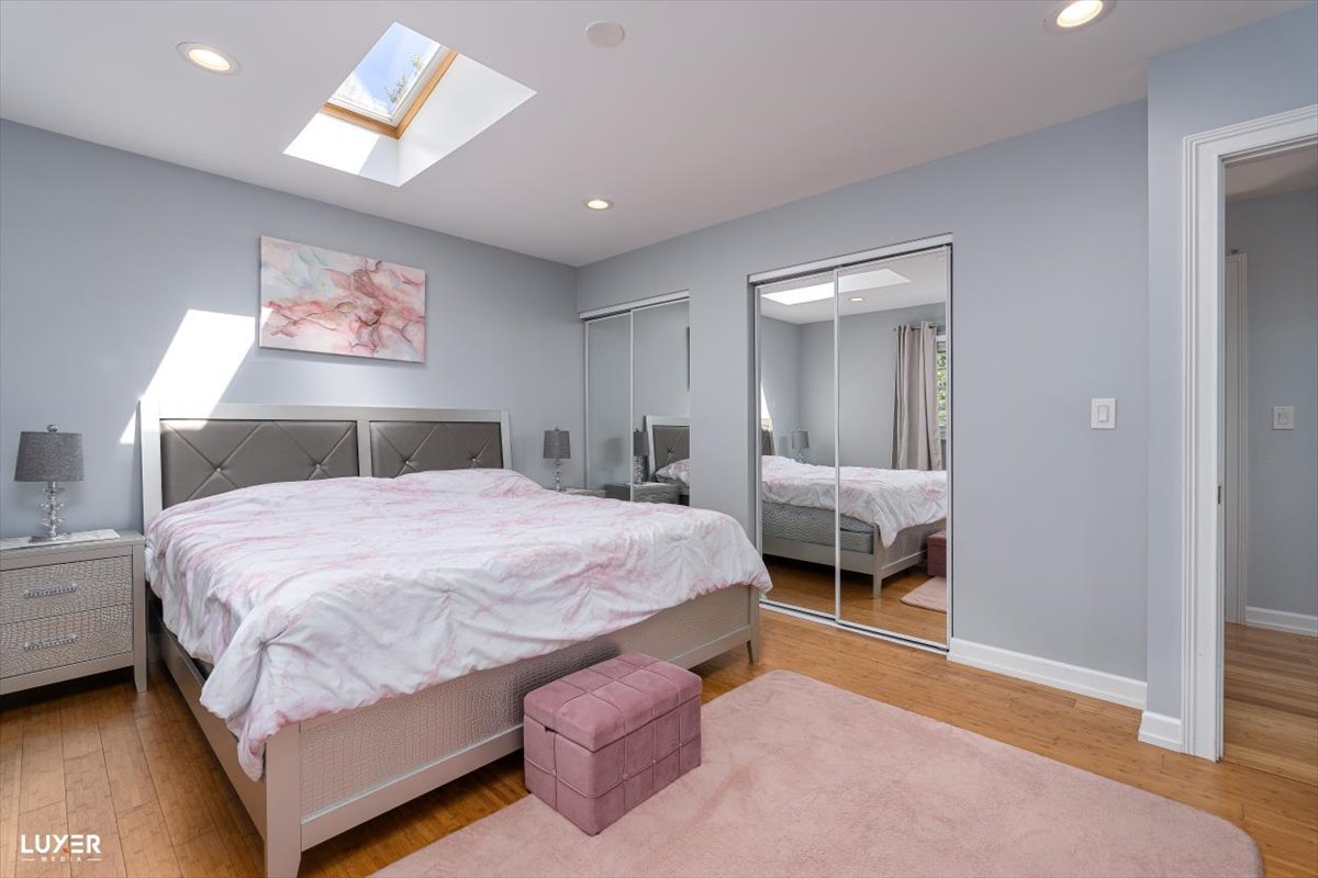 6908 Orchard Lane Hanover Park, IL 60133 - Photo 16 of 28 a bedroom with a bed and a painting