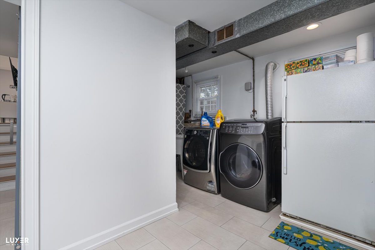 6908 Orchard Lane Hanover Park, IL 60133 - Photo 24 of 28 a utility room with dryer and washer