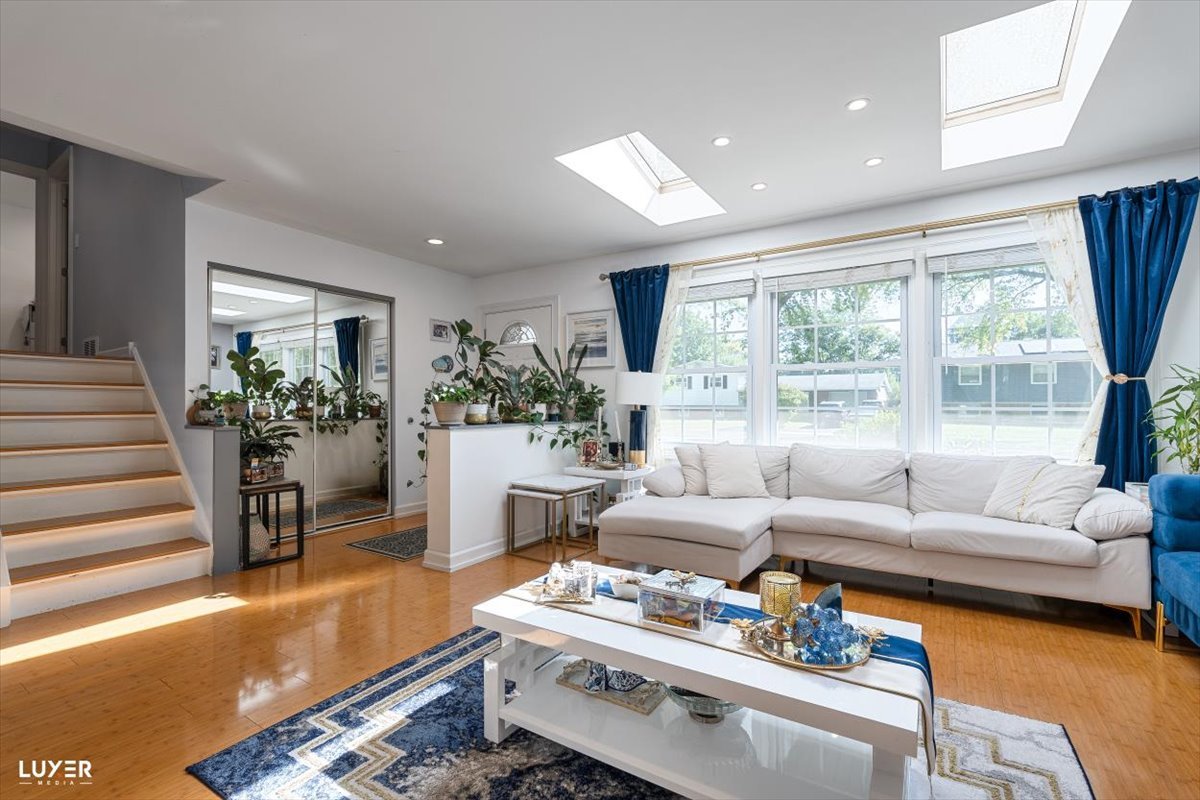 6908 Orchard Lane Hanover Park, IL 60133 - Photo 5 of 28 a living room with furniture and a large window