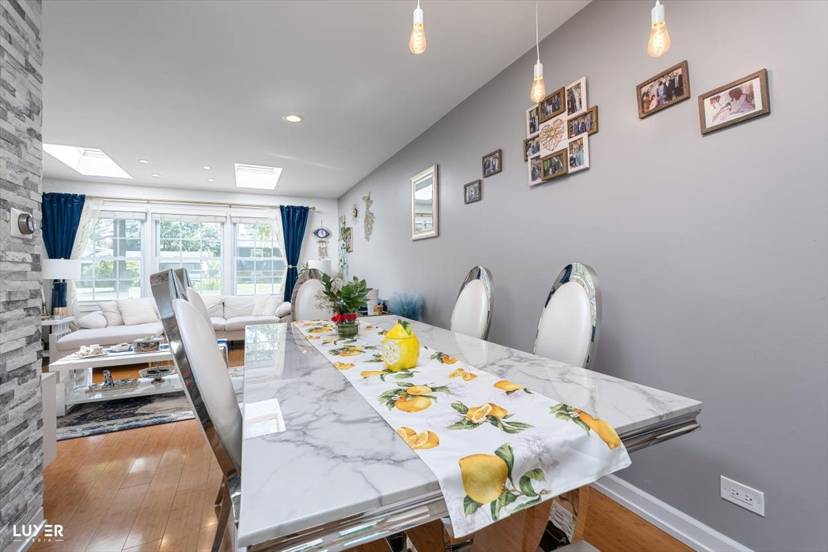 6908 Orchard Lane Hanover Park, IL 60133 - Photo 9 of 28 a bedroom with furniture and a flat screen tv