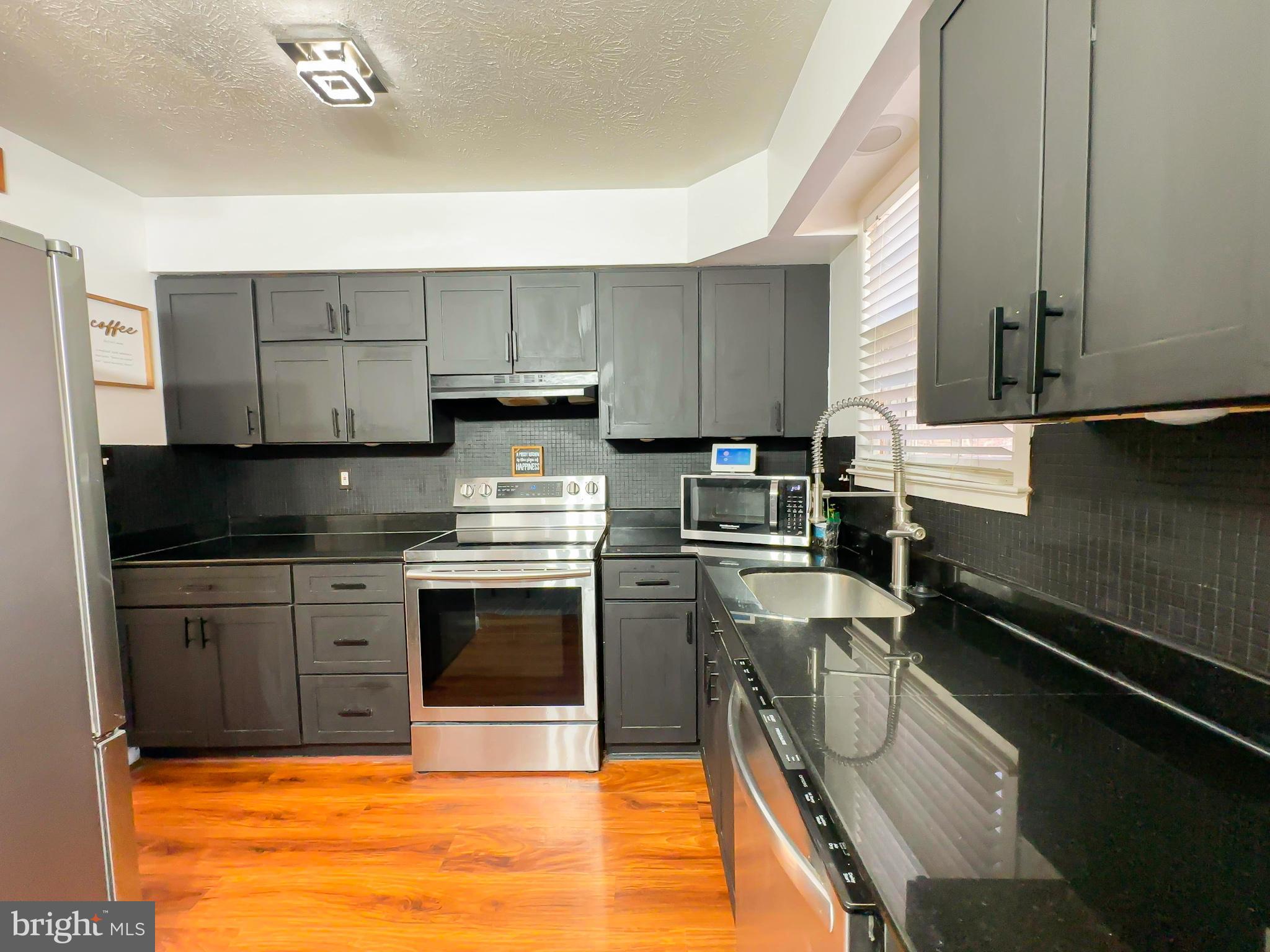 8504 Heatherwick Drive Brandywine, MD 20613 - Photo 11 of 51 a kitchen with a sink appliances and cabinets