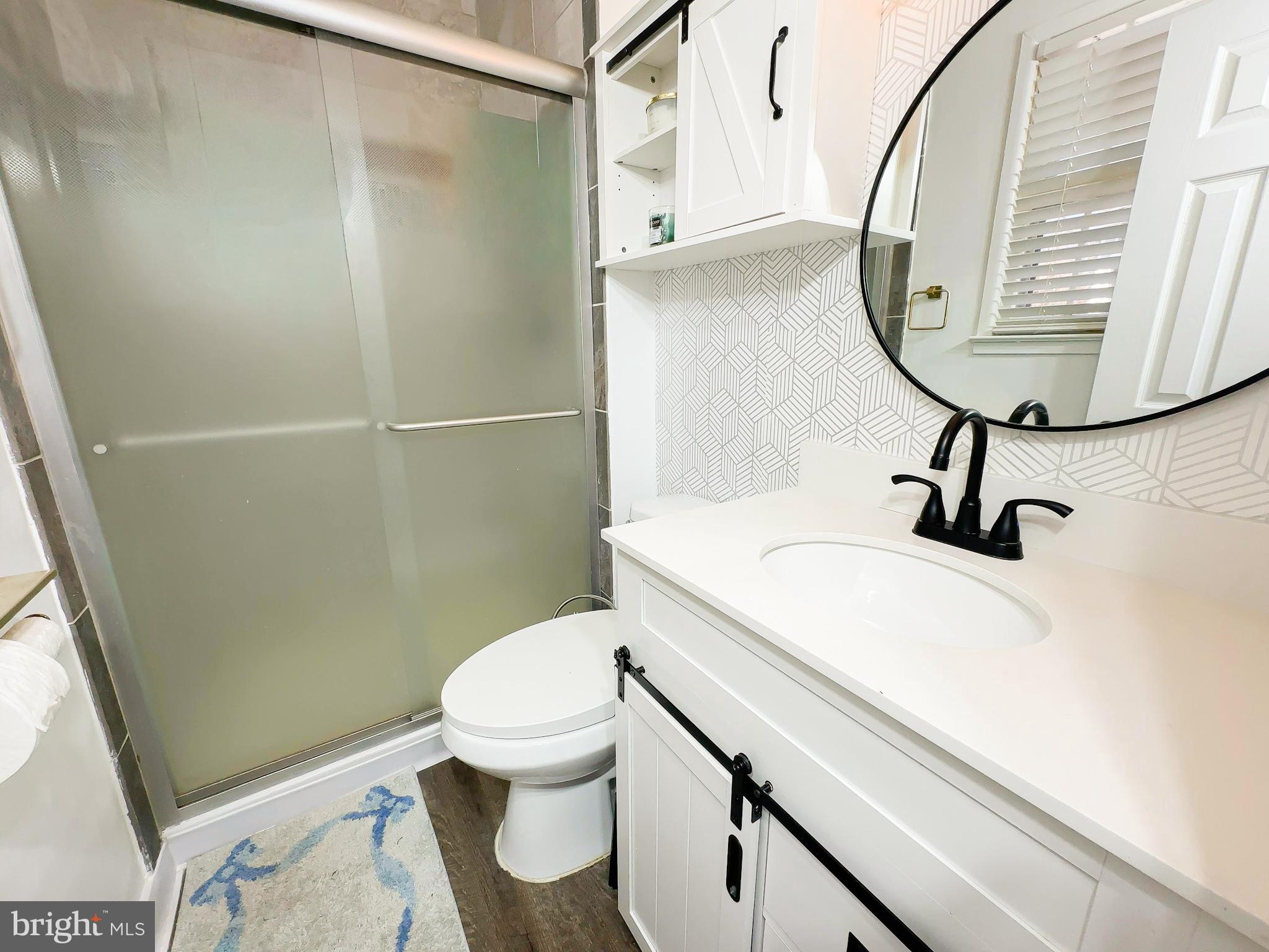 8504 Heatherwick Drive Brandywine, MD 20613 - Photo 14 of 51 a bathroom with a sink toilet and a mirror