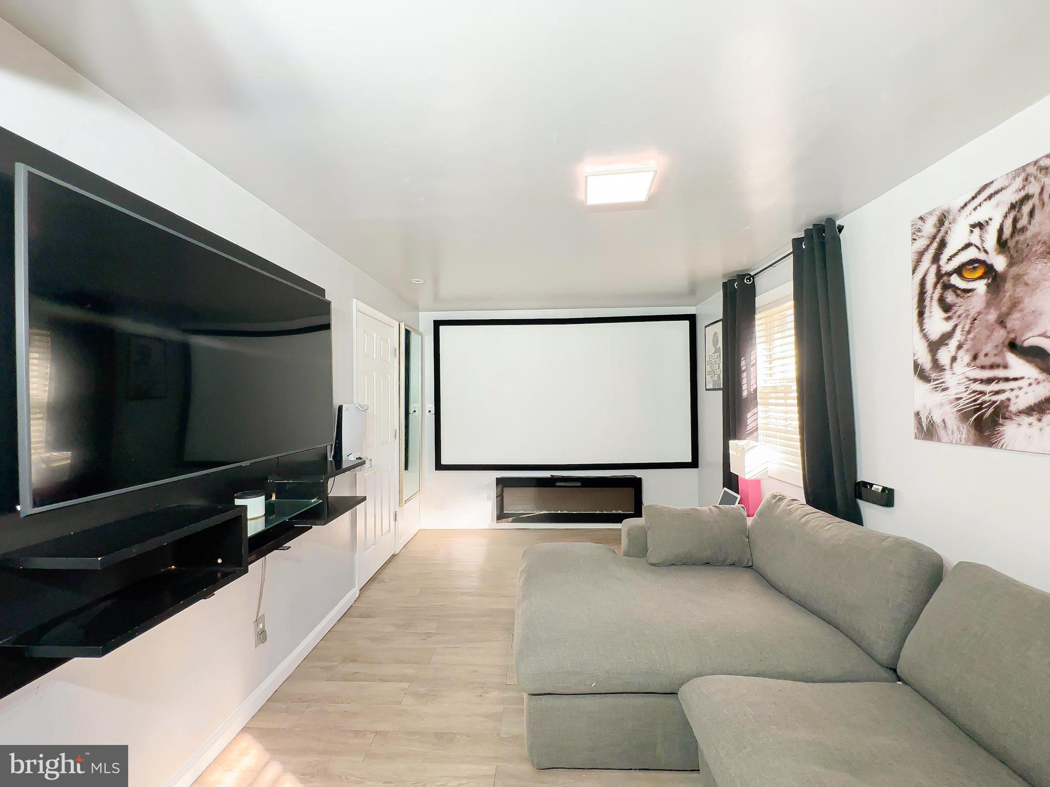 8504 Heatherwick Drive Brandywine, MD 20613 - Photo 17 of 51 a living room with furniture and a flat screen tv