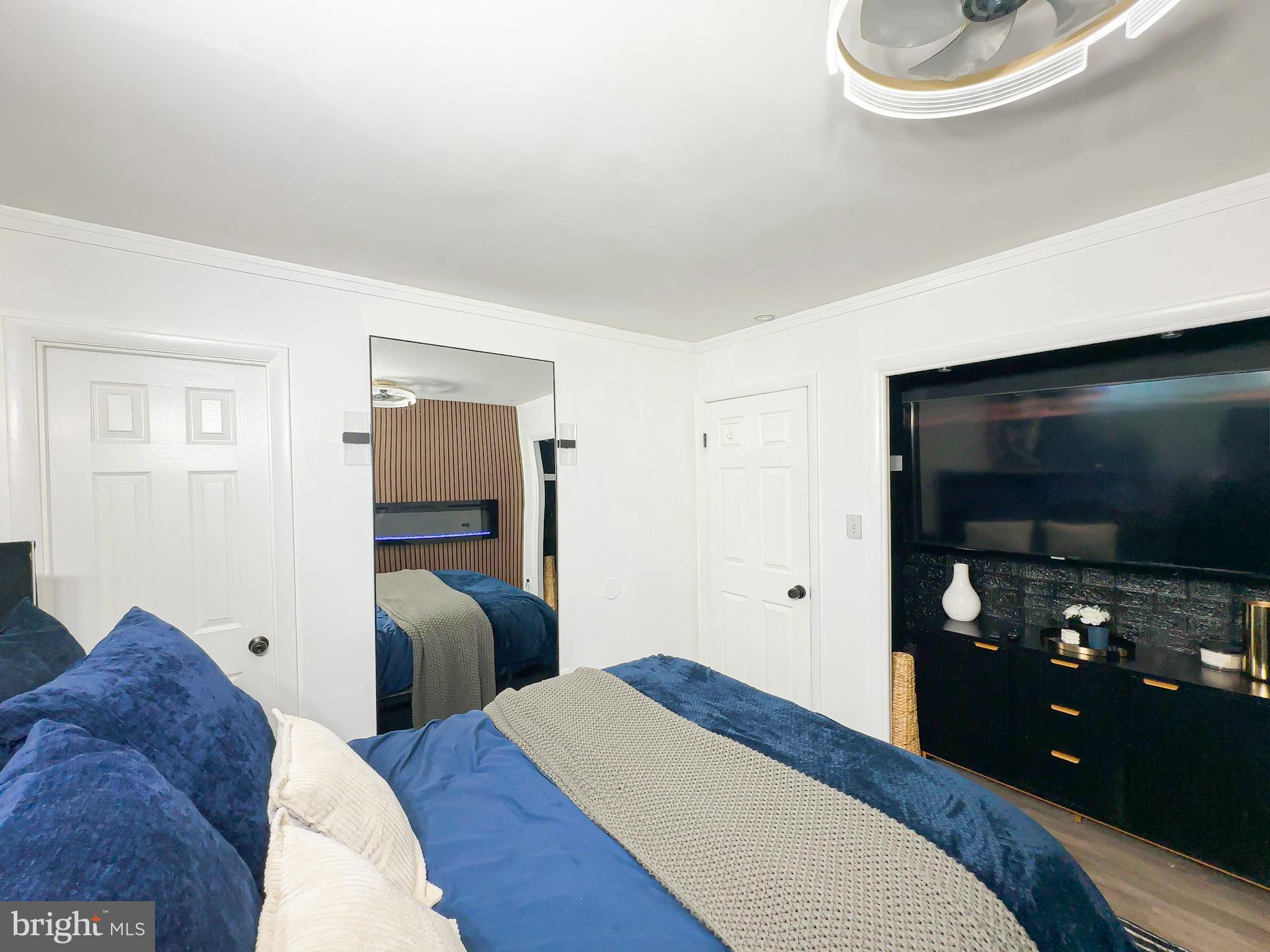 8504 Heatherwick Drive Brandywine, MD 20613 - Photo 19 of 51 a bedroom with a bed and a flat screen tv