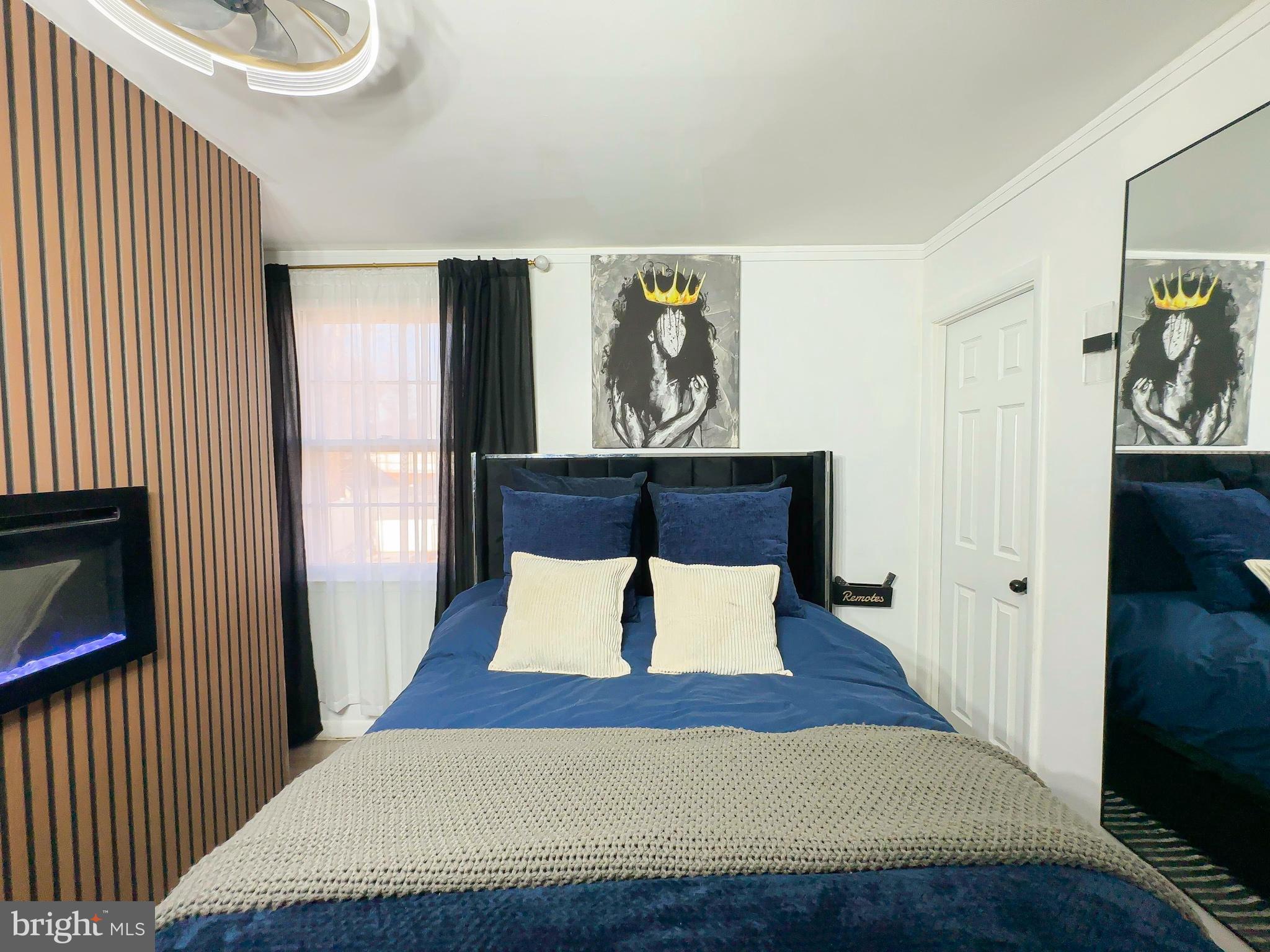 8504 Heatherwick Drive Brandywine, MD 20613 - Photo 21 of 51 a bedroom with a bed and lamp