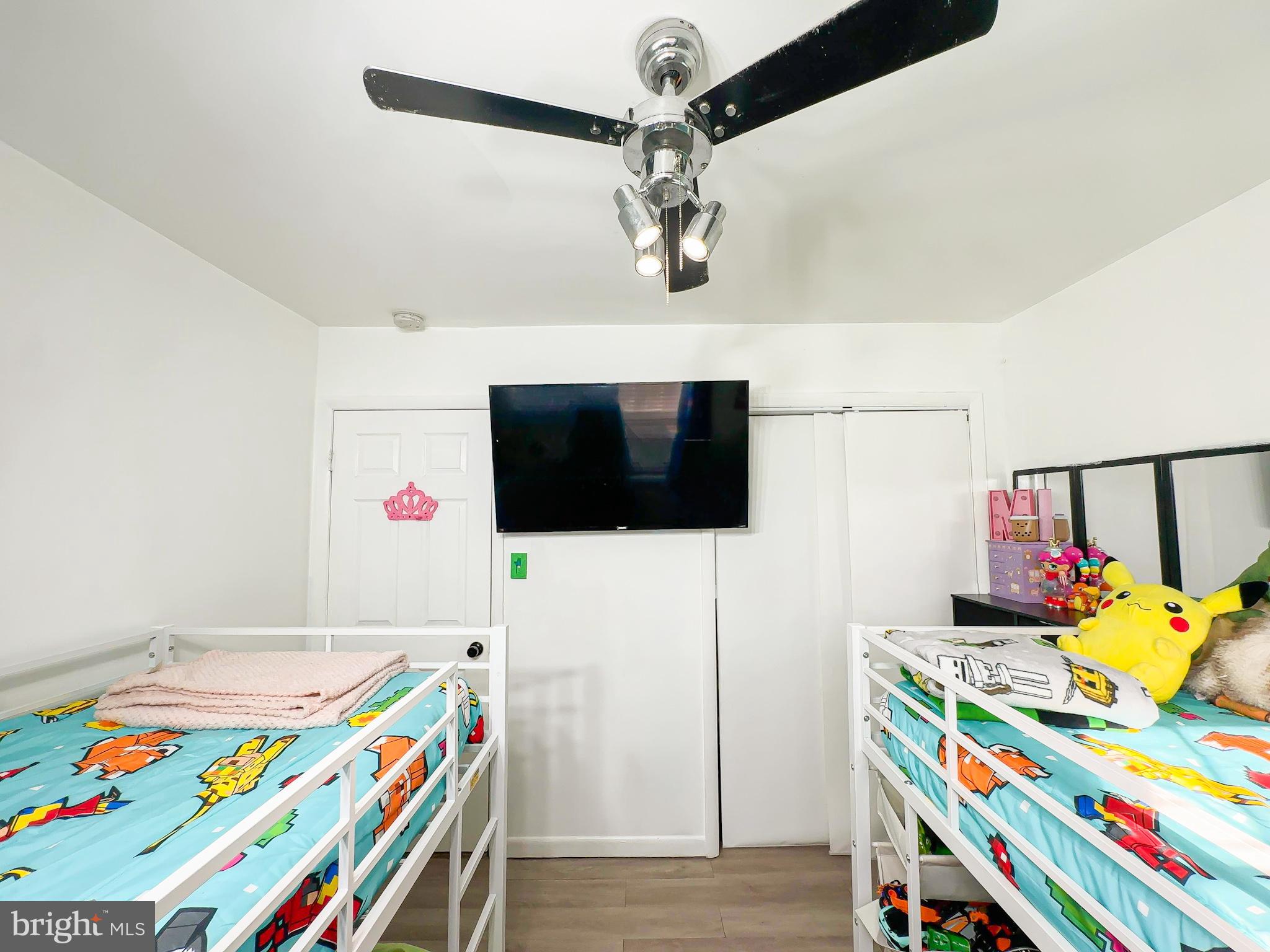8504 Heatherwick Drive Brandywine, MD 20613 - Photo 28 of 51 a room with furniture and a flat screen tv