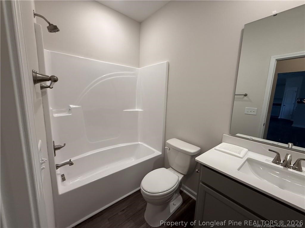 4075 Blue Springs Red Springs, NC 28377 - Photo 11 of 25 a bathroom with a granite countertop sink toilet and shower