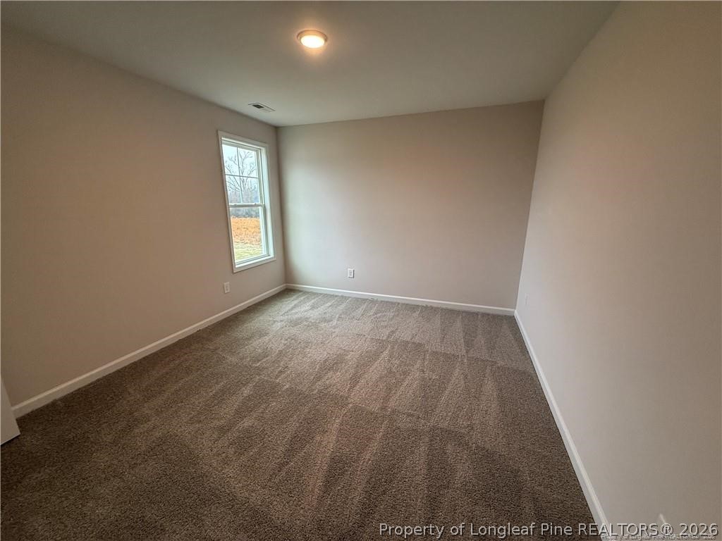 4075 Blue Springs Red Springs, NC 28377 - Photo 23 of 25 an empty room with wooden floor and windows