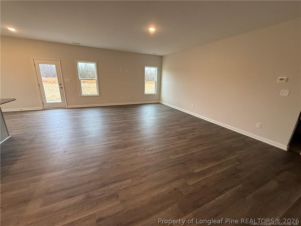 4075 Blue Springs Red Springs, NC 28377 - Photo 7 of 25 an empty room with wooden floor and windows