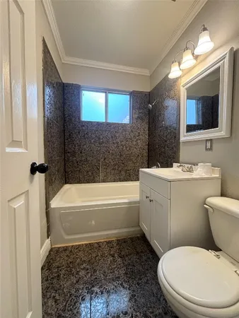 a bathroom with a sink a toilet and bathtub