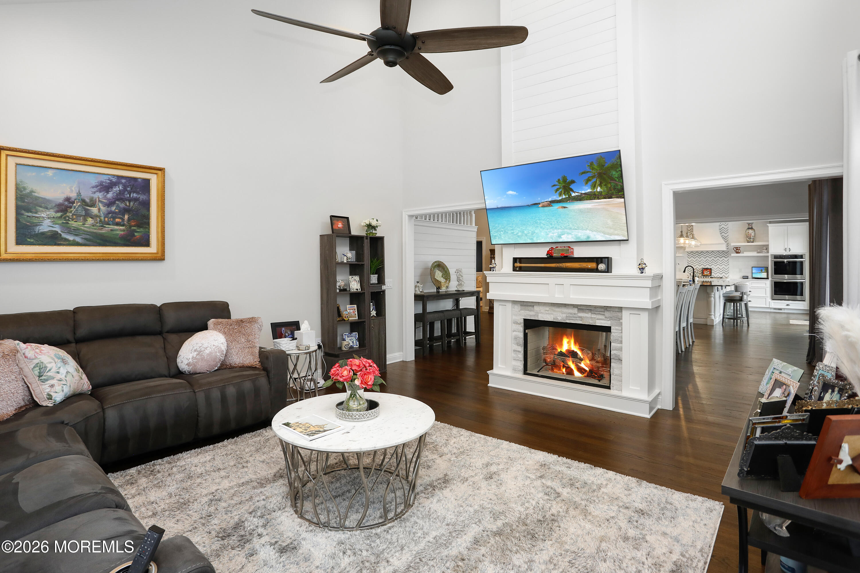 50 Neptune Road Toms River, NJ 08753 - Photo 13 of 73 a living room with furniture and a fireplace