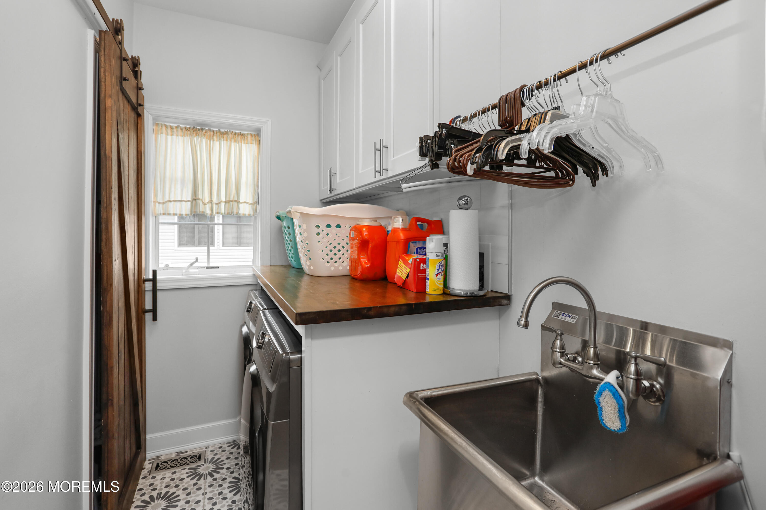 50 Neptune Road Toms River, NJ 08753 - Photo 22 of 73 a kitchen with a sink and a stove top oven