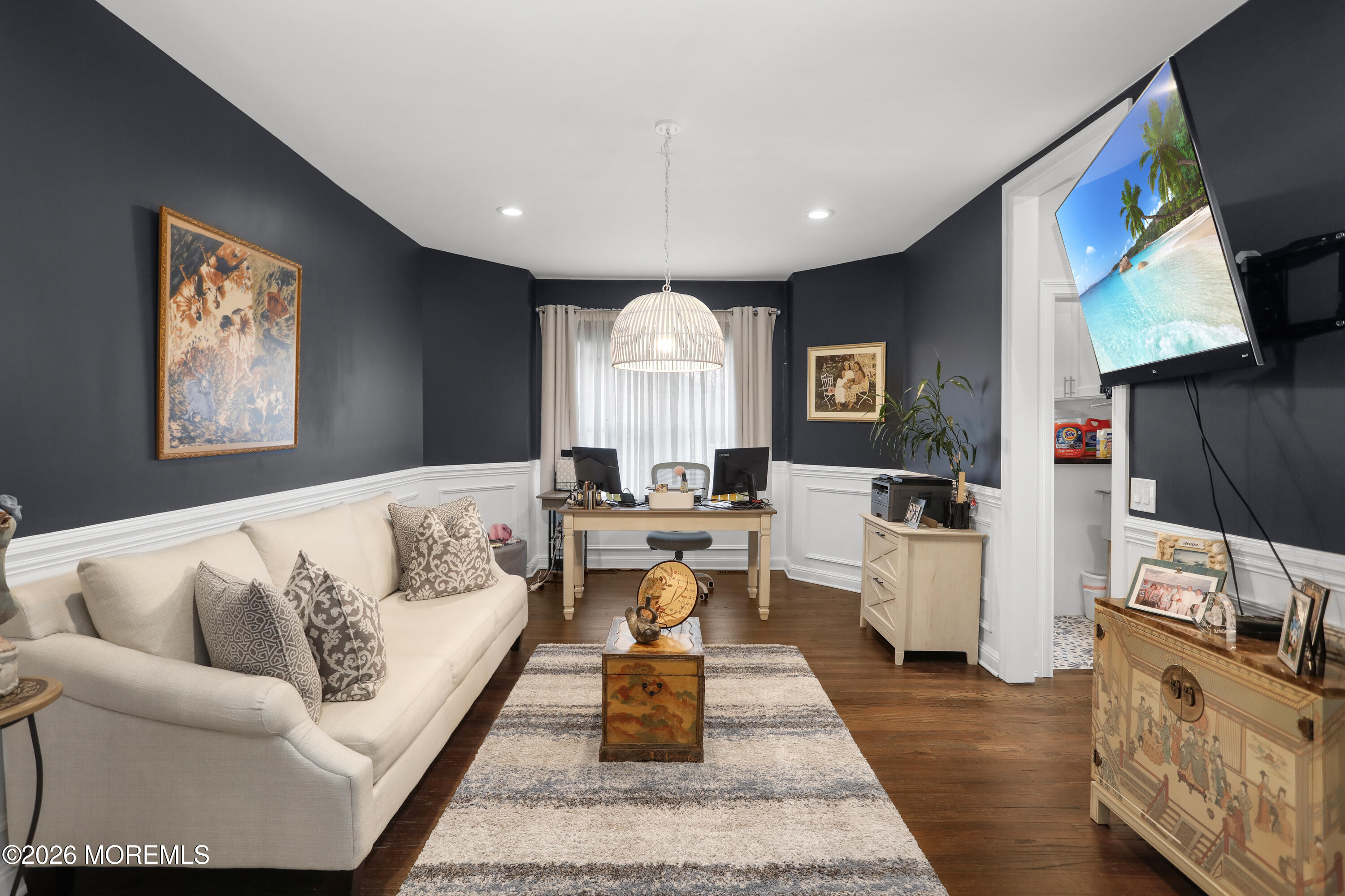 50 Neptune Road Toms River, NJ 08753 - Photo 24 of 73 a living room with furniture and a flat screen tv