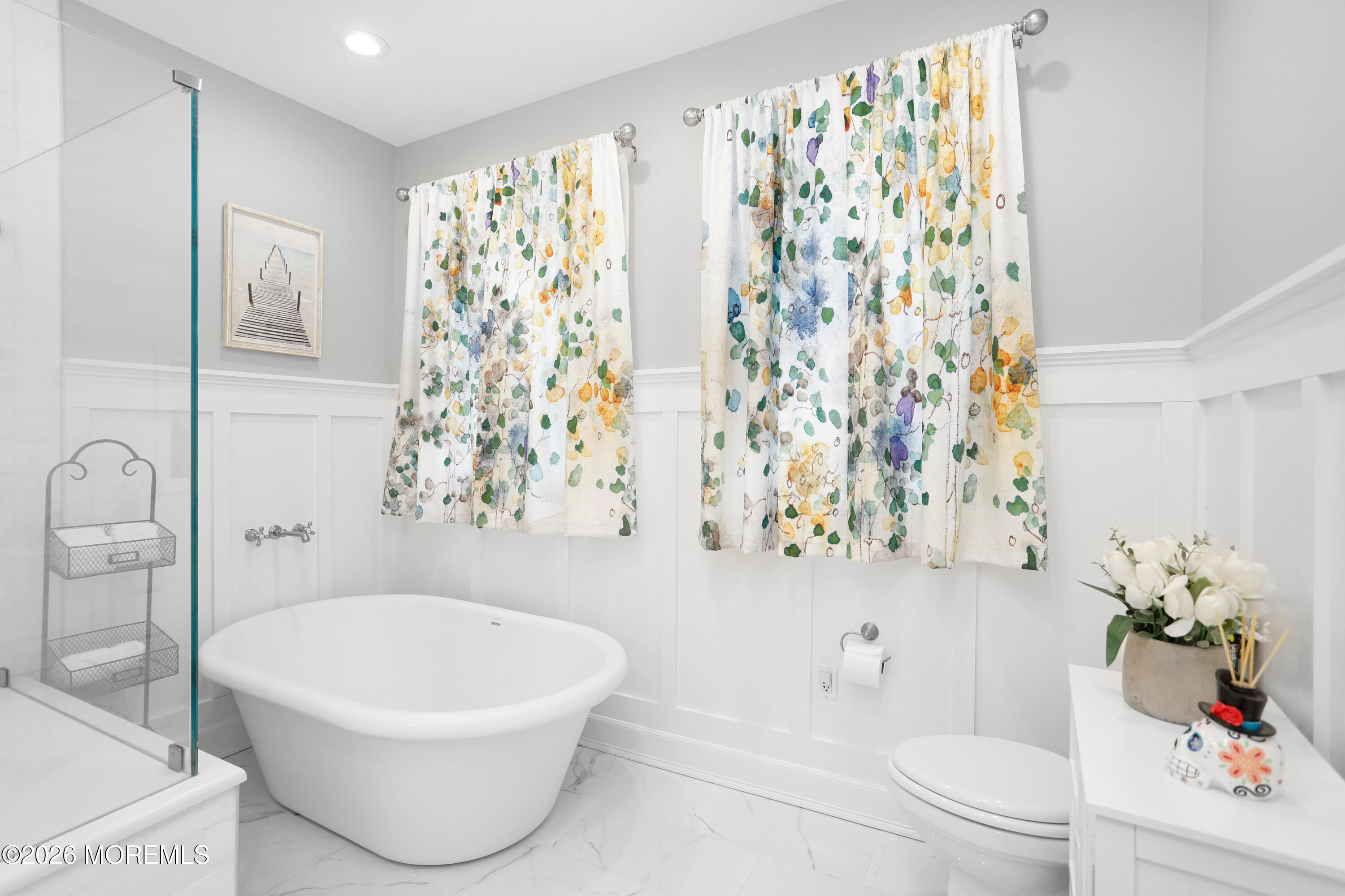 50 Neptune Road Toms River, NJ 08753 - Photo 27 of 73 a white bath tub sitting next to a white toilet and a shower curtain