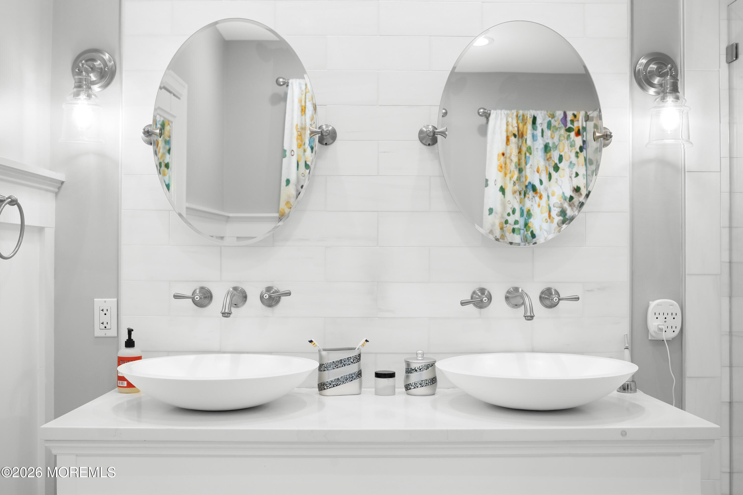 50 Neptune Road Toms River, NJ 08753 - Photo 30 of 73 a bathroom with a mirror and a sink