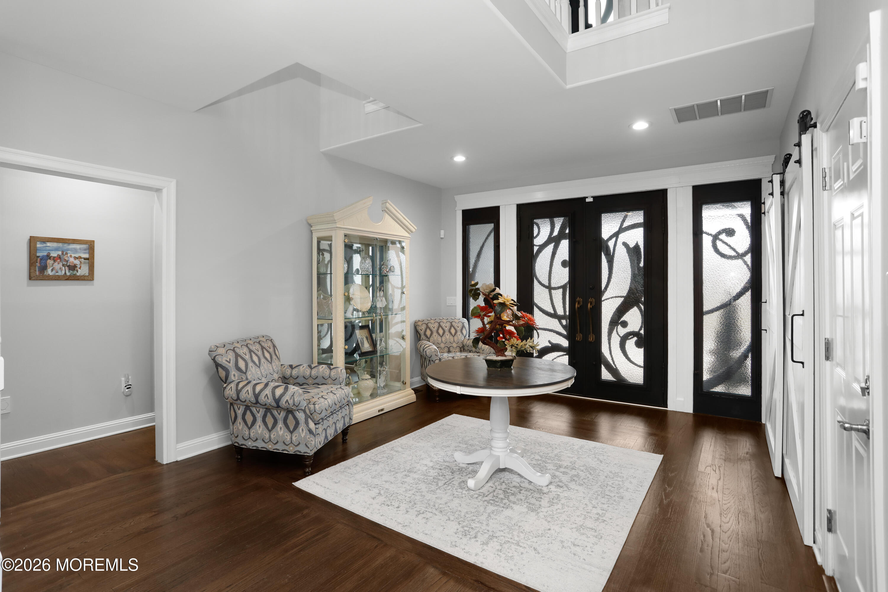 50 Neptune Road Toms River, NJ 08753 - Photo 4 of 73 a living room with furniture and a gate