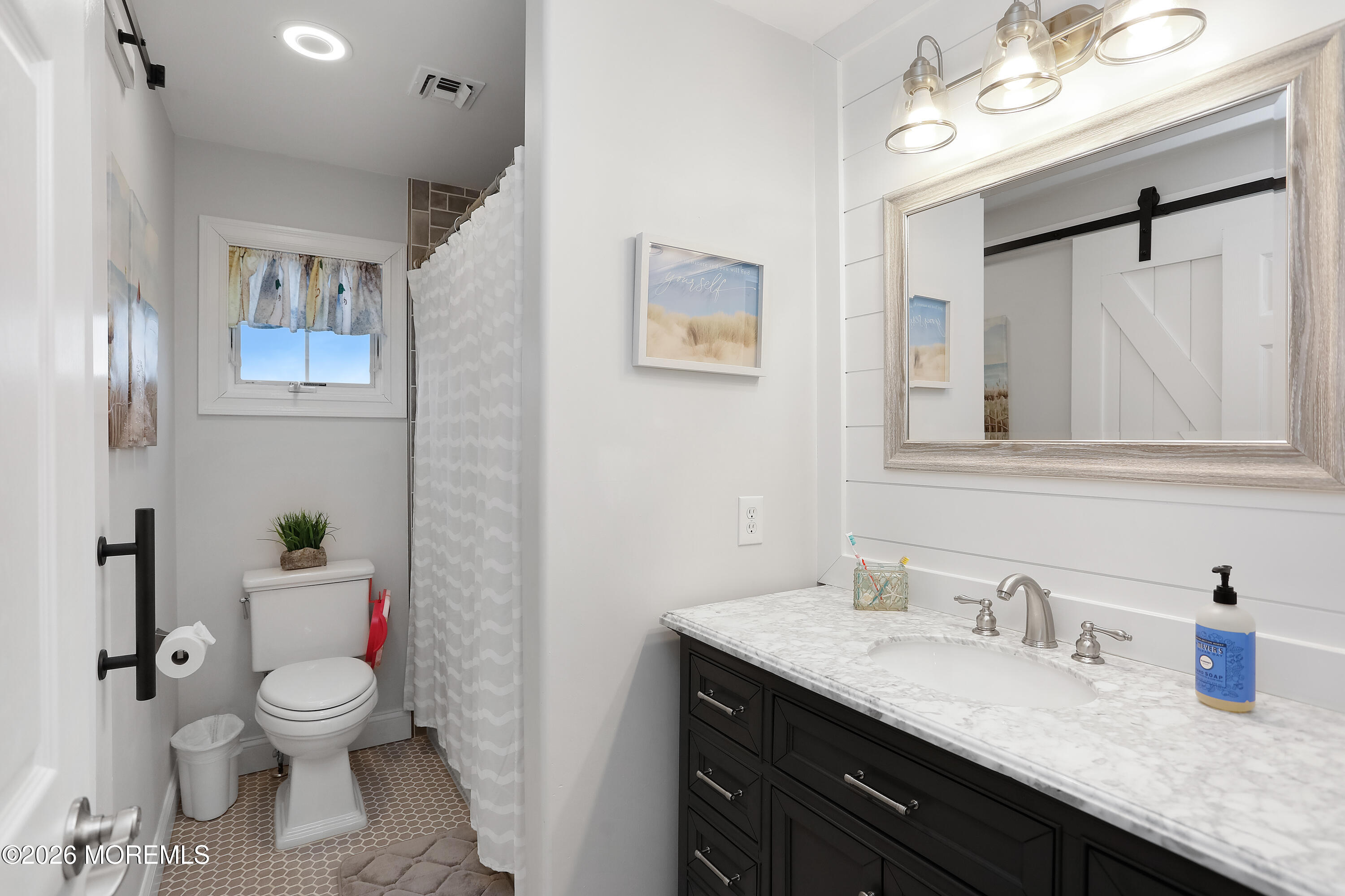 50 Neptune Road Toms River, NJ 08753 - Photo 45 of 73 a bathroom with a granite countertop toilet sink and mirror