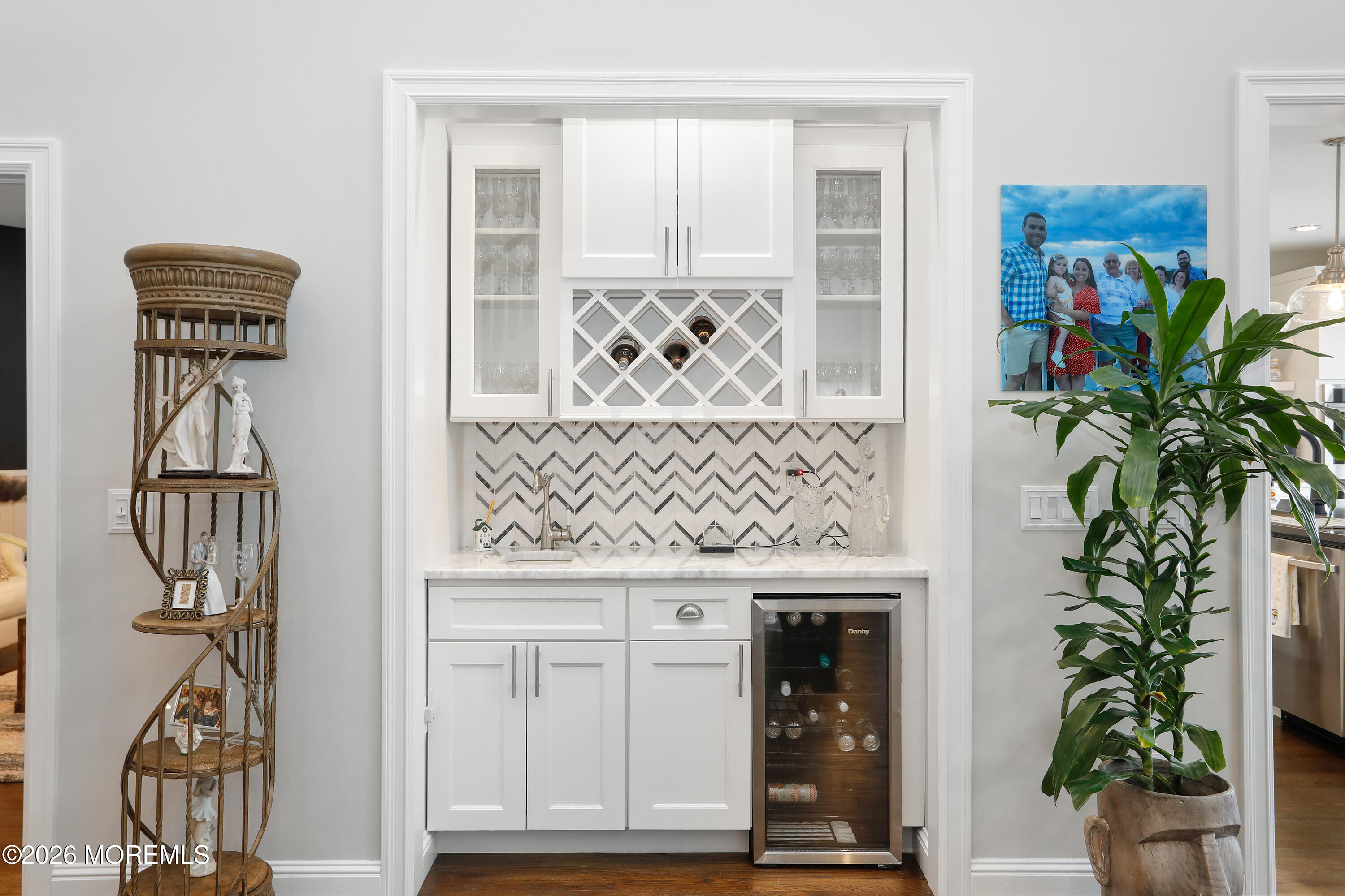 50 Neptune Road Toms River, NJ 08753 - Photo 10 of 73 a potted plant sitting on top of a wooden floor