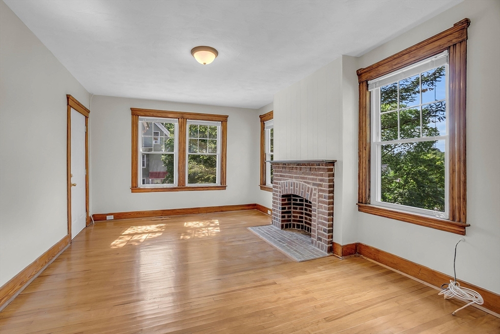 5 Wakefield Street Worcester, MA 01605 - Photo 16 of 42 a view of an empty room with a window and wooden floor