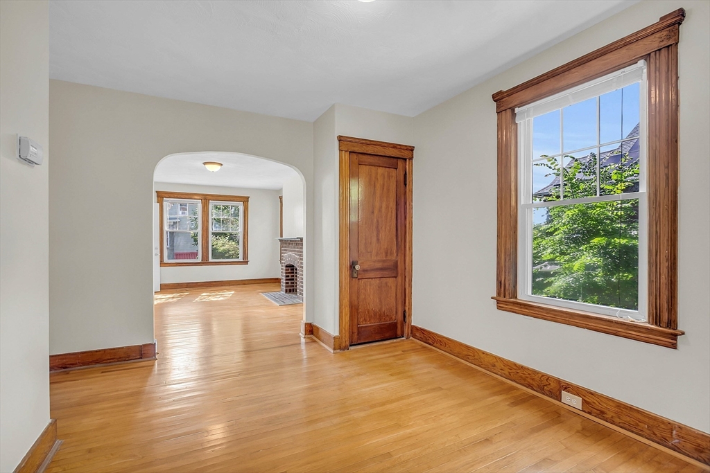 5 Wakefield Street Worcester, MA 01605 - Photo 17 of 42 an empty room with wooden floor and windows