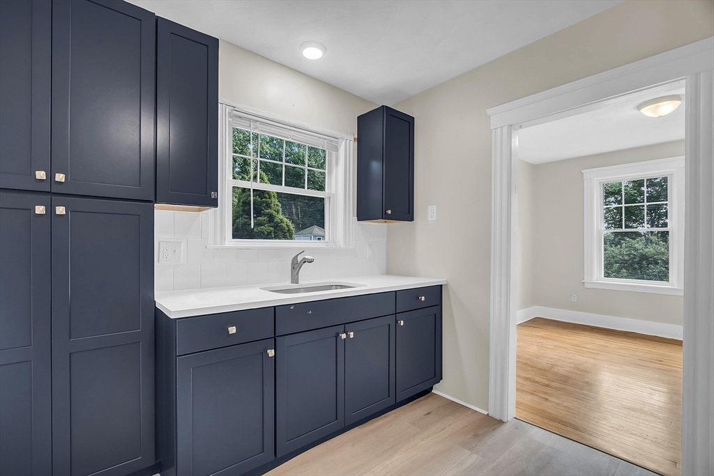 5 Wakefield Street Worcester, MA 01605 - Photo 22 of 42 a spacious bathroom with a double vanity sink a mirror and a bathtub