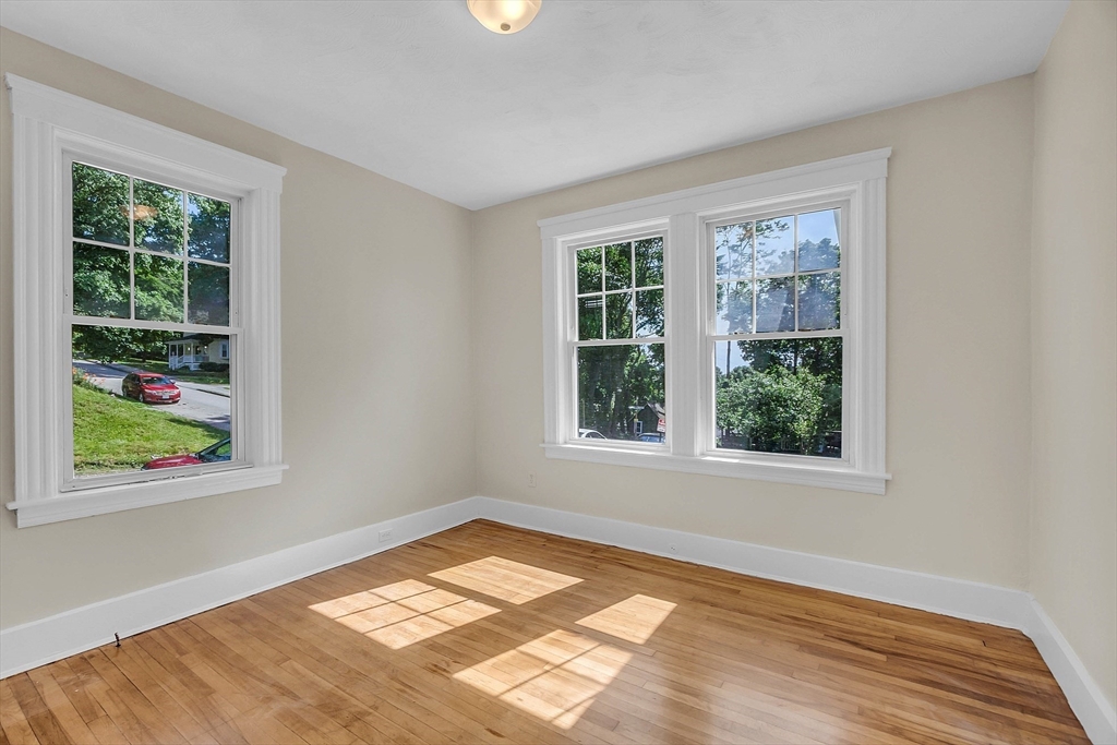5 Wakefield Street Worcester, MA 01605 - Photo 24 of 42 a view of an empty room with wooden floor and a window