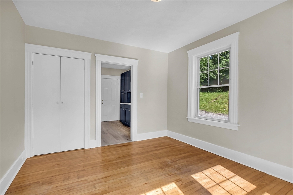 5 Wakefield Street Worcester, MA 01605 - Photo 25 of 42 a view of an empty room with wooden floor and a window