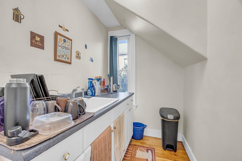 5 Wakefield Street Worcester, MA 01605 - Photo 30 of 42 a dining room with furniture and a wooden floor