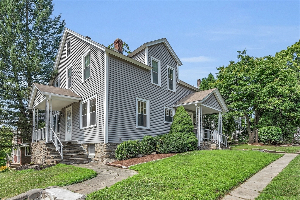 5 Wakefield Street Worcester, MA 01605 - Photo 3 of 42 a front view of a house with a yard and trees
