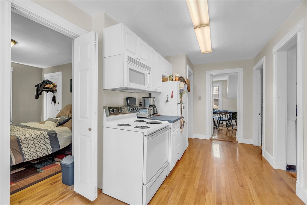 5 Wakefield Street Worcester, MA 01605 - Photo 31 of 42 a kitchen with a refrigerator and a stove
